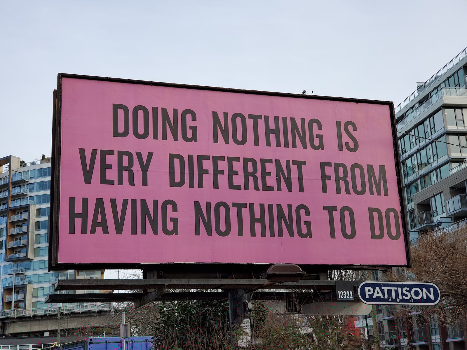 a large pink billboard with a quote on it